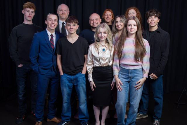 The cast posed together