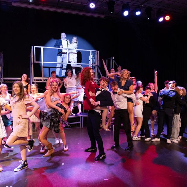 The full company in a big dance number