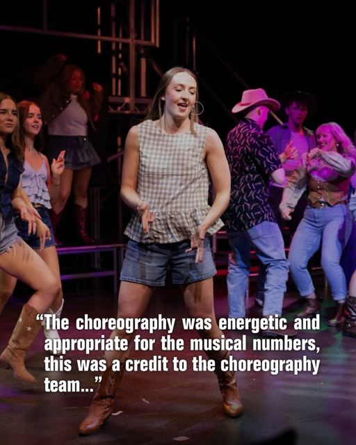 Dancers in cowboy boots, with a review quote