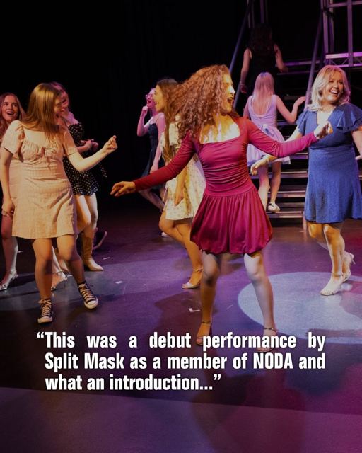 Dancers on stage, with a review quote